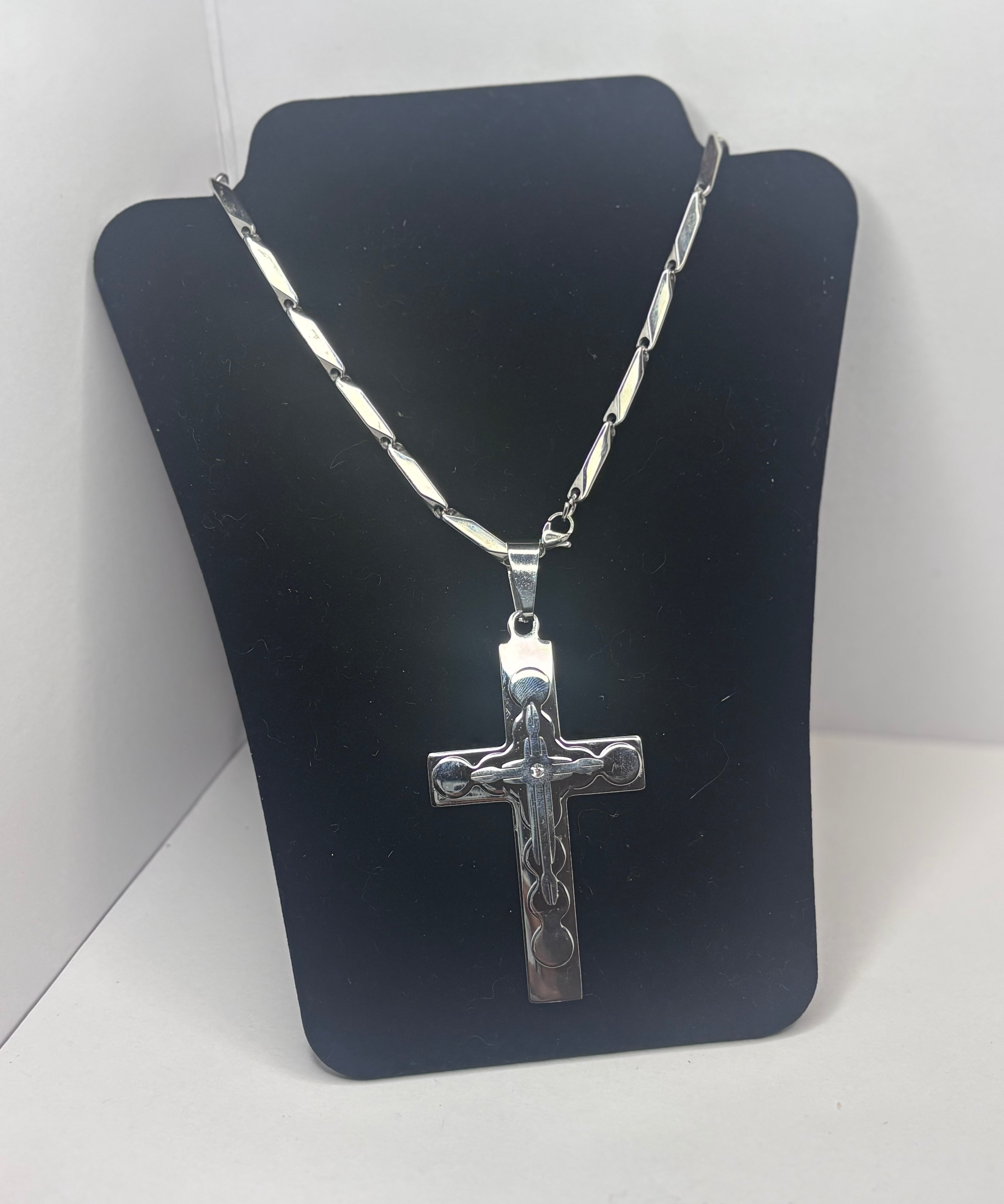 30 in sterling sliver crucifix pendant necklace on a Figaro link chain.