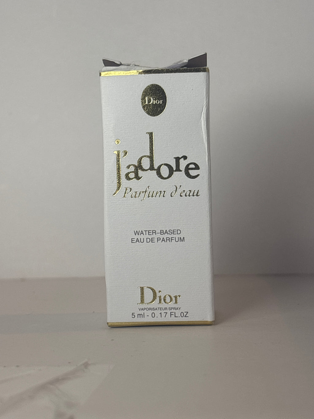 Dior J'adore Parfum d'Eau fragrance bottle in a miniature 5ml (0.17 oz) size.