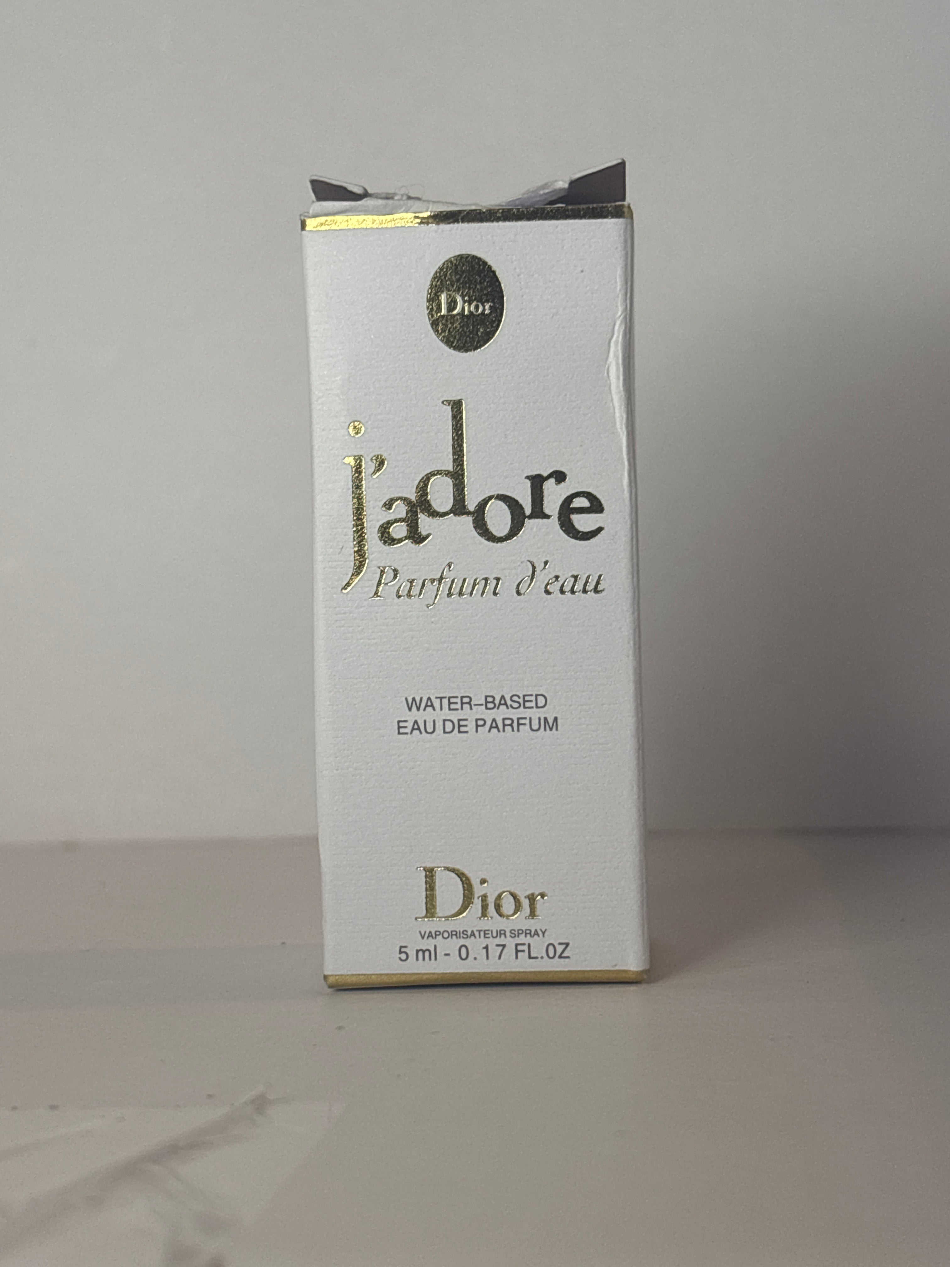 Dior J'adore Parfum d'Eau fragrance bottle in a miniature 5ml (0.17 oz) size.