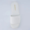 Cushionaire slide sandals featuring a comfortable open-toe slip-on design in a light gray color.