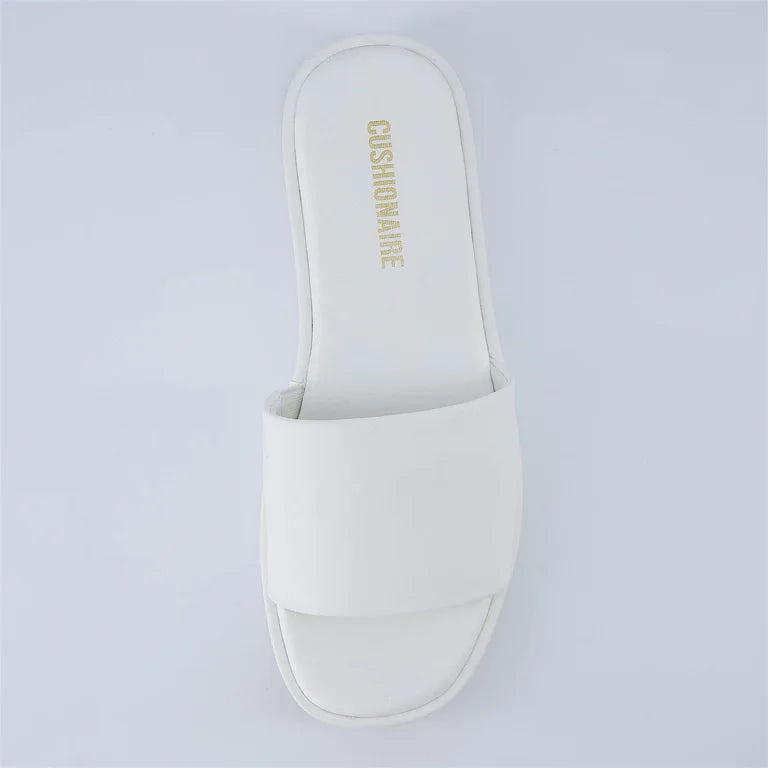 Cushionaire slide sandals featuring a comfortable open-toe slip-on design in a light gray color.